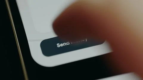 User interface button labeled Send Money,, person initiates a funds transfer Stock Footage 331581132