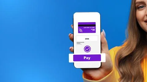 User makes online payment on a smartphone in a bright setting during the day Stock Photos