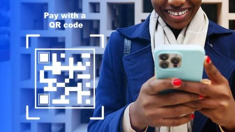 User making an online payment using a QR code at a modern store Fotos de archivo