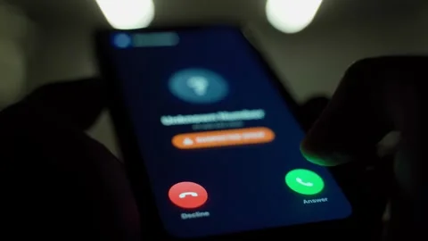 User not answering call from unknown number. Smartphone screen with incoming 스톡 동영상 340388556