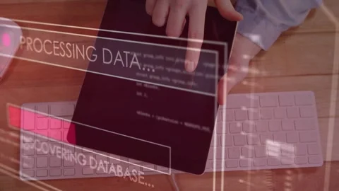 User placing tablet, tapping screen and initiating workflow to process data and Stock Footage 335317554