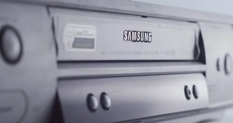 User playing VHS video cassette on a vintage VCR player - analog home cinema 動画素材 146540699