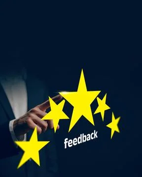 User provides feedback using star rating on a digital platform Stock Photos