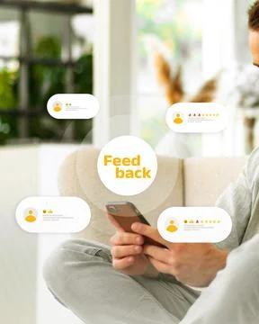 User reading feedback on mobile device in a bright indoor space Stock Photos