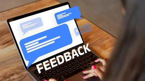 User receiving feedback on a laptop screen during a work session Stock Photos