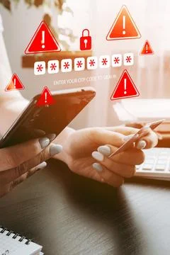 User receiving scam message while holding phone and card during online banking Stock Photos