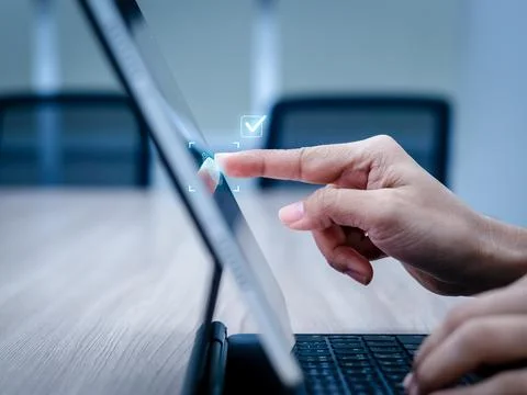 User scanning fingerprint on laptop for biometric verification. Secure acce.. 写真素材