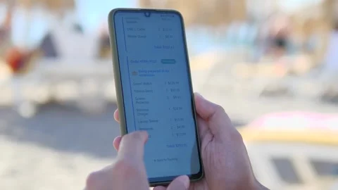 User scrolling purchase list and monitoring parcel preparation on phone. Stock Footage 328626350