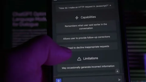 User scrolling on a Smartphone the ChatGPT Webpage. Developed by OpenAI. Stock Footage 231158339