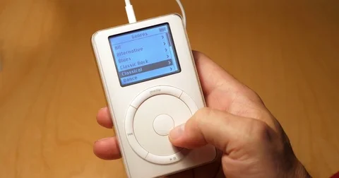 User Scrolls Through Music on Old iPod Stock Footage