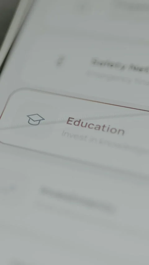 User selects Education as an investment category Stock Footage 332496936