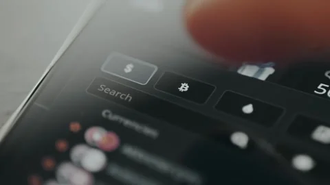 User selects the option with Bitcoin symbol for monitoring market data Video stock 330252702