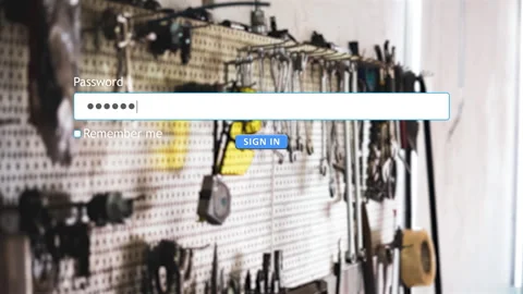 User signs in to website using password with car tools in background Stock Footage 334022697