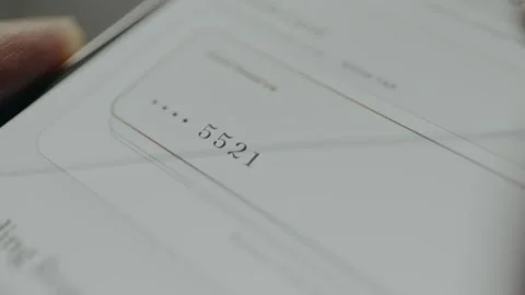 User taps and switches between digital credit cards on screen Stock Footage 332510677