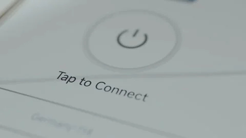User taps the button to initiate the connection process to a remote server, VPN Video stock 329748606