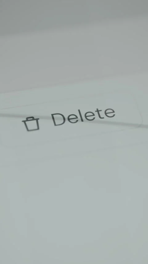 User taps the Delete button with a trash icon Video stock 333381967