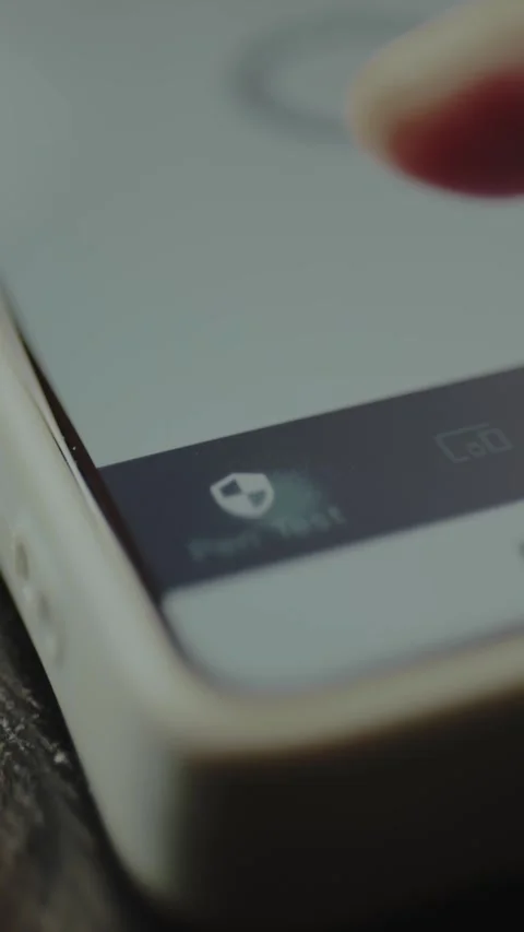 User taps the Pen Test icon on the mobile phone screen Stock Footage 328354785