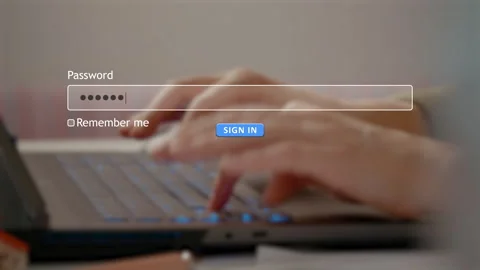 User types password to sign in on website as hacker watches closely Stock Footage 334022252