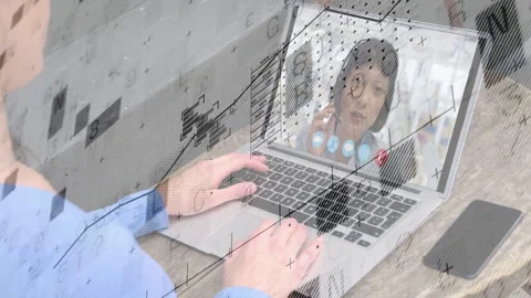 User typing as peer smiling and lifting handset, charts moving over laptop Stock Footage 334703240