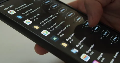 User updating apps on smartphone device - keeping up to date Stock Footage 279821737
