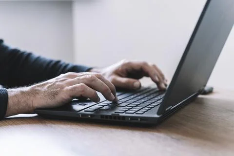 User uses the computer at the desktop in the office or at home. Business, study Stock Photos