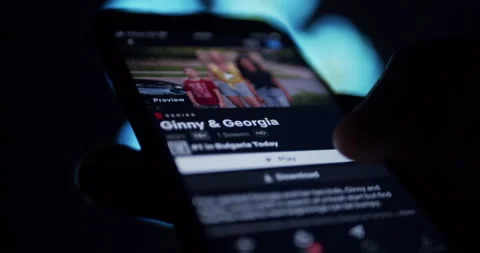 User watching Netflix streaming from smartphone at night - binge watching Stock Footage 150903984