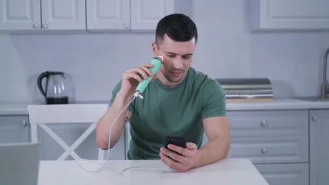 Uses face pore vacuum cleaner Stock Footage 129057861