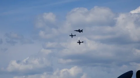 U.S.A.F. Heritage Flight with 2x P-51 Mustangs and an F-16 Fighting Falcon Stock Footage 114438118