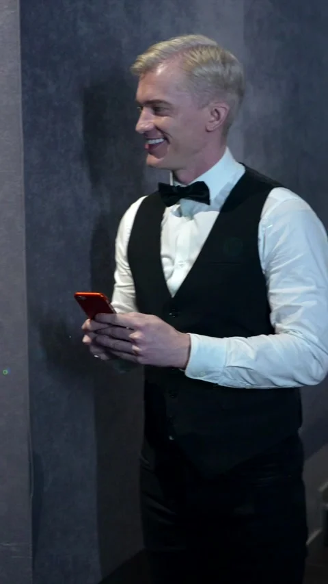 Usher scanning tickets and giving popcorn at movie theater Stock Footage 305838075