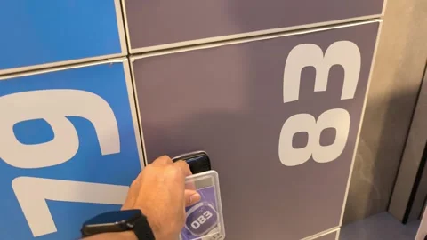 Using Access Card to Unlock a Numbered Locker Gray and Blue Color with Bag Stock-Footage 343382619