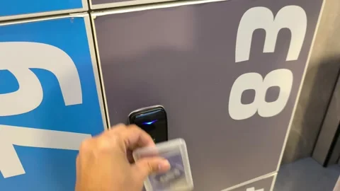 Using Access Card to Unlock a Numbered Locker with Empty Box Stock-Footage 343393959