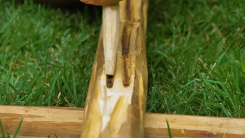 Using an age-old technique, two wooden objects are being rubbed together Vídeos de archivo 269756249