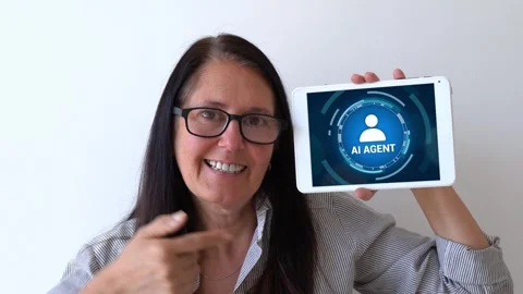 Using AI agents for your work and repetitive tasks. Happy woman holding up Stock Footage 305491749