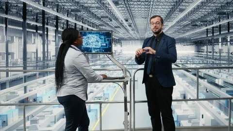 Using AI, microchips and industry 4.0 plant directors innovating production Stock Footage 333381158