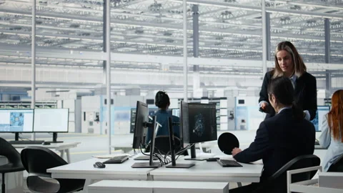 Using AI model, semiconductor substrates and microchip facility senior manager Stock Footage 335880170