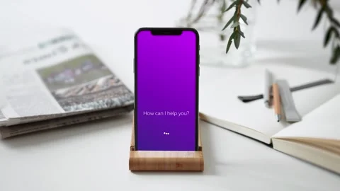 Using AI Personal Assistant App on a Smartphone in Office Over White Desktop Video stock 266156493