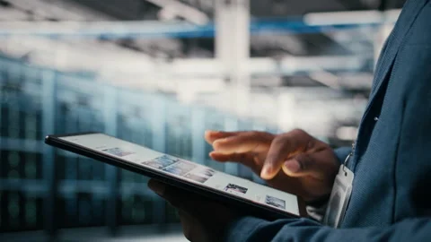 Using AI software, tablet close up and engineer in data center Stock Footage 330376622