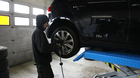 Using the airpump on the cartires Stock Footage 36350127