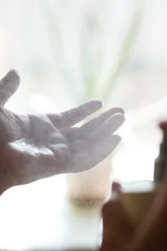 Using antiseptic spray every where during covid-19 Stock Photos