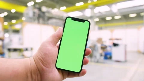 Using an app in a warehouse greenscreen Stock Footage 143463444