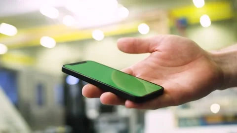 Using an app in a warehouse greenscreen Stock Footage 143463476