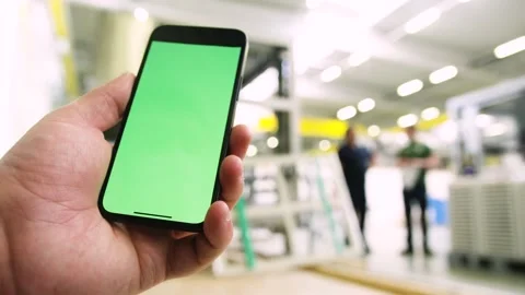 Using an app in a warehouse greenscreen Stock Footage 143463477