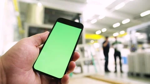 Using an app in a warehouse greenscreen Stock Footage 143463480