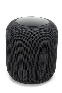 Using an Apple HomePod speaker on white Stock Photos