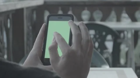 Using Apple IPhone 6 On A Balcony With Greenscreen Stock Footage 52253728