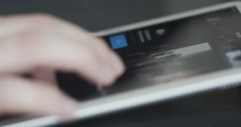 Using Apple TV+ video streaming app on a digital tablet iPad device Stock Footage 130393153