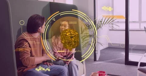Using AR interface, coworkers wearing office attire interacting in office lounge Stock Photos