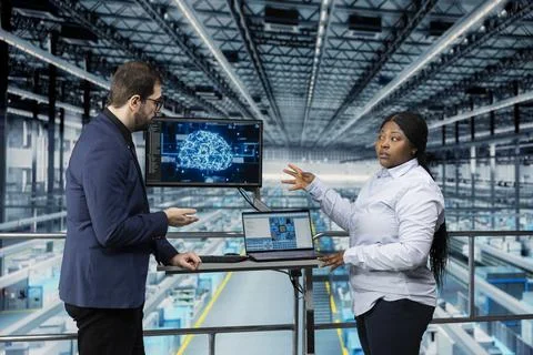 Using artificial intelligence, microchips and man with colleague Stock Photos