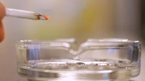 Using Ashtray with cigarette Stock Footage 122243894