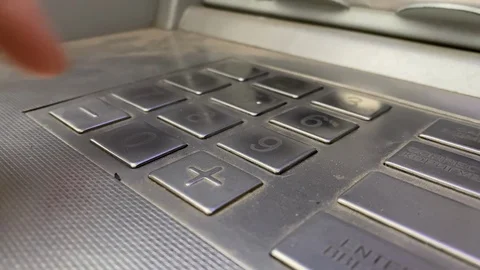Using ATM machine to manage money, male hand entering pin code on ATM dial panel Stock Footage 127413137